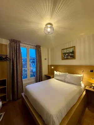 Un ou plusieurs lits dans un hébergement de l'établissement Hôtel Montmartre - Nouvellement Rénové
