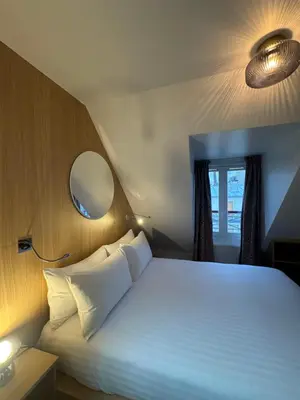Un ou plusieurs lits dans un hébergement de l'établissement Hôtel Montmartre - Nouvellement Rénové