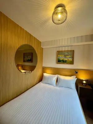 Un ou plusieurs lits dans un hébergement de l'établissement Hôtel Montmartre - Nouvellement Rénové
