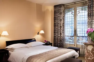 Un ou plusieurs lits dans un hébergement de l'établissement Hôtel Vaneau Saint Germain
