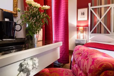 Un ou plusieurs lits dans un hébergement de l'établissement Hotel Louvre Bons Enfants
