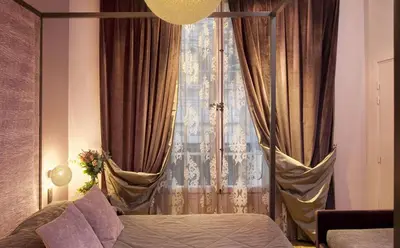 Un ou plusieurs lits dans un hébergement de l'établissement Hotel Louvre Bons Enfants