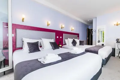 Un ou plusieurs lits dans un hébergement de l'établissement HOTEL DE PARIS MONTPARNASSE