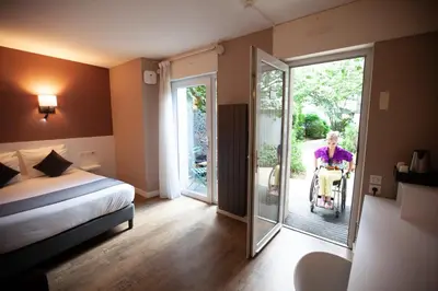 Un ou plusieurs lits dans un hébergement de l'établissement HOTEL DE PARIS MONTPARNASSE