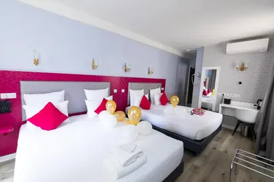 Un ou plusieurs lits dans un hébergement de l'établissement HOTEL DE PARIS MONTPARNASSE