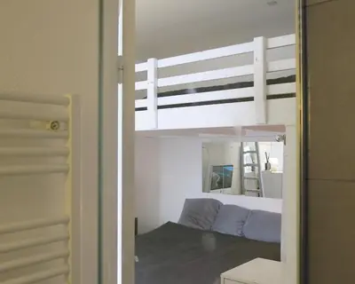 Un ou plusieurs lits dans un hébergement de l'établissement Mini Loft Del Sarte CityCosy