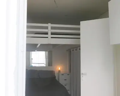 Un ou plusieurs lits dans un hébergement de l'établissement Mini Loft Del Sarte CityCosy