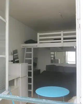 Un ou plusieurs lits dans un hébergement de l'établissement Mini Loft Del Sarte CityCosy