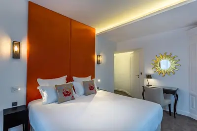 Un ou plusieurs lits dans un hébergement de l'établissement Hôtel La Comtesse