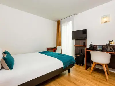Un ou plusieurs lits dans un hébergement de l'établissement Aparthotel Adagio Access Paris Porte De Charenton