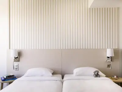 Un ou plusieurs lits dans un hébergement de l'établissement Aparthotel Adagio Paris Centre Tour Eiffel