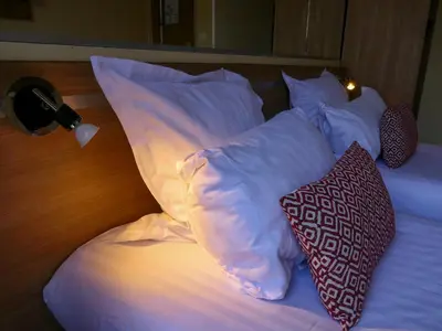 Un ou plusieurs lits dans un hébergement de l'établissement Hôtel de France Quartier Latin