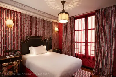 Un ou plusieurs lits dans un hébergement de l'établissement Hôtel de Joséphine BONAPARTE