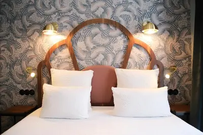 Un ou plusieurs lits dans un hébergement de l'établissement Hotel André Latin