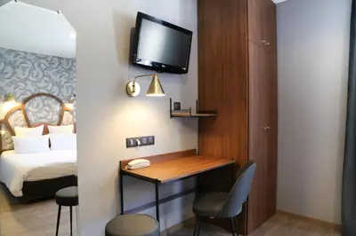 Un ou plusieurs lits dans un hébergement de l'établissement Hotel André Latin