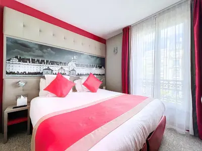 Un ou plusieurs lits dans un hébergement de l'établissement Best Western Nouvel Orléans Montparnasse