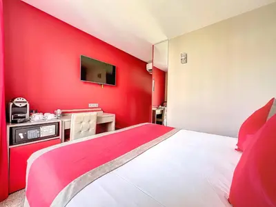 Un ou plusieurs lits dans un hébergement de l'établissement Best Western Nouvel Orléans Montparnasse