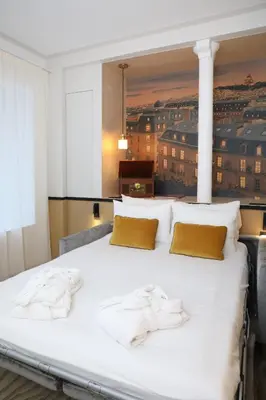 Un ou plusieurs lits dans un hébergement de l'établissement Five Boutique Hotel Paris Quartier Latin