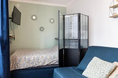 Un ou plusieurs lits dans un hébergement de l'établissement Duplex Atypique Paris 13 Station F Bercy