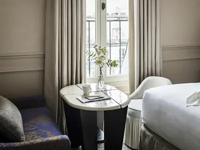 Un ou plusieurs lits dans un hébergement de l'établissement Sofitel Le Scribe Paris Opera