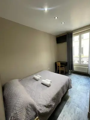Un ou plusieurs lits dans un hébergement de l'établissement Hôtel de l'Aveyron