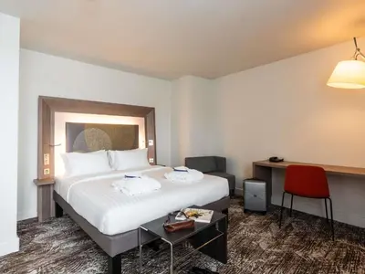 Un ou plusieurs lits dans un hébergement de l'établissement Novotel Paris Gare De Lyon