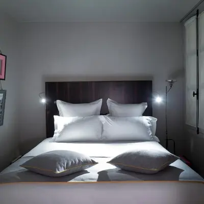 Un ou plusieurs lits dans un hébergement de l'établissement Hotel Saint Dominique
