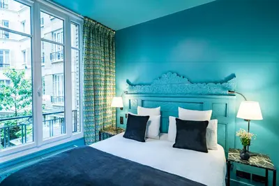 Un ou plusieurs lits dans un hébergement de l'établissement Hotel Villa Nicolo - Tour Eiffel