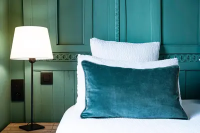 Un ou plusieurs lits dans un hébergement de l'établissement Hotel Villa Nicolo - Tour Eiffel