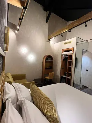 Un ou plusieurs lits dans un hébergement de l'établissement Hotel Du Cadran
