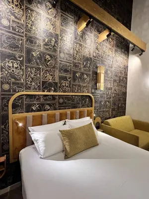 Un ou plusieurs lits dans un hébergement de l'établissement Hotel Du Cadran