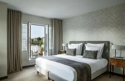 Un ou plusieurs lits dans un hébergement de l'établissement Hôtel Parc Saint-Séverin - Esprit de France