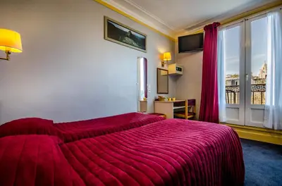 Un ou plusieurs lits dans un hébergement de l'établissement Avenir Hotel Montmartre