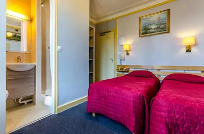Un ou plusieurs lits dans un hébergement de l'établissement Avenir Hotel Montmartre