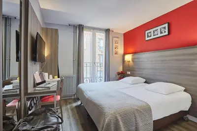 Un ou plusieurs lits dans un hébergement de l'établissement Huni Hôtel