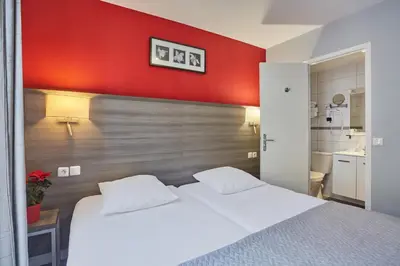 Un ou plusieurs lits dans un hébergement de l'établissement Huni Hôtel