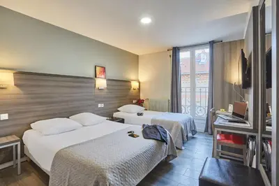 Un ou plusieurs lits dans un hébergement de l'établissement Huni Hôtel