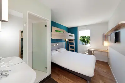 Un ou plusieurs lits dans un hébergement de l'établissement ibis budget Porte D'Orleans