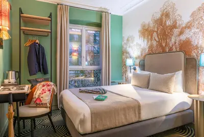 Un ou plusieurs lits dans un hébergement de l'établissement Hotel Avalon Paris