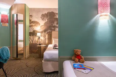 Un ou plusieurs lits dans un hébergement de l'établissement Hotel Avalon Paris