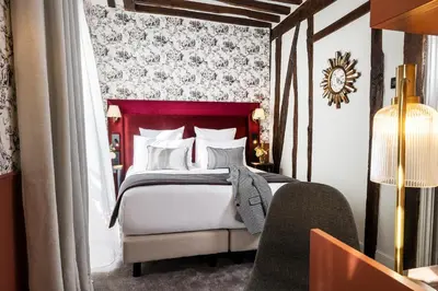 Un ou plusieurs lits dans un hébergement de l'établissement Hotel Louis II