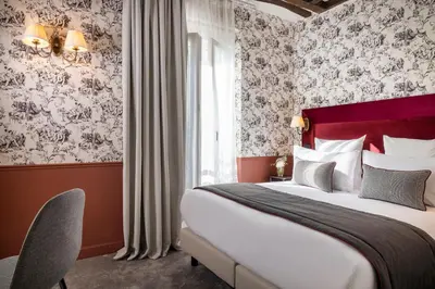 Un ou plusieurs lits dans un hébergement de l'établissement Hotel Louis II