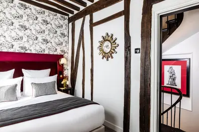 Un ou plusieurs lits dans un hébergement de l'établissement Hotel Louis II