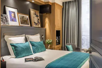 Un ou plusieurs lits dans un hébergement de l'établissement Hotel Ducs de Bourgogne