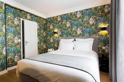 Un ou plusieurs lits dans un hébergement de l'établissement Hôtel Mathis Elysées