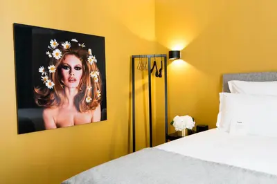 Un ou plusieurs lits dans un hébergement de l'établissement Hôtel Mathis Elysées