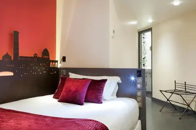 Un ou plusieurs lits dans un hébergement de l'établissement Hôtel Aurore Paris Gare de Lyon