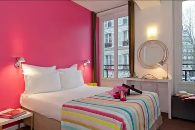 Un ou plusieurs lits dans un hébergement de l'établissement Hôtel Marais de Launay