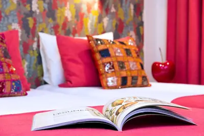 Un ou plusieurs lits dans un hébergement de l'établissement Hôtel Villa Bohème