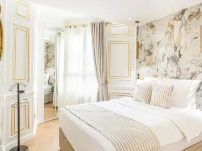 Un ou plusieurs lits dans un hébergement de l'établissement Merveil - Luxury Suite - Tour Eiffel - Bourdonnais